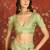 Green chiffon zari checks saree with unstitched blouse piece.