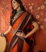 Orange chiffon zari checks saree with unstitched blouse piece.