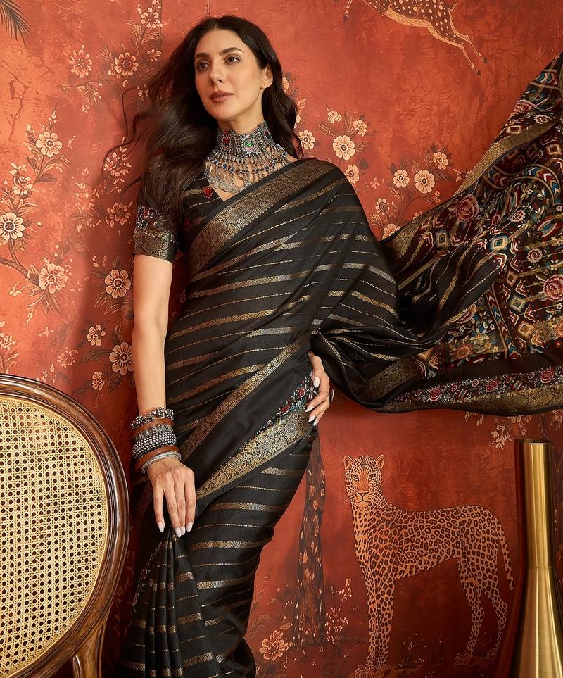 Black silk cotton zari saree with unstitched blouse piece.