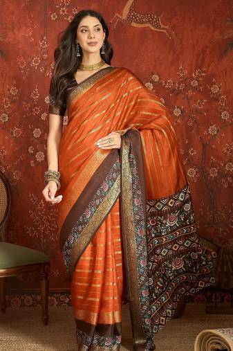 Orange silk cotton zari saree with unstitched blouse piece.