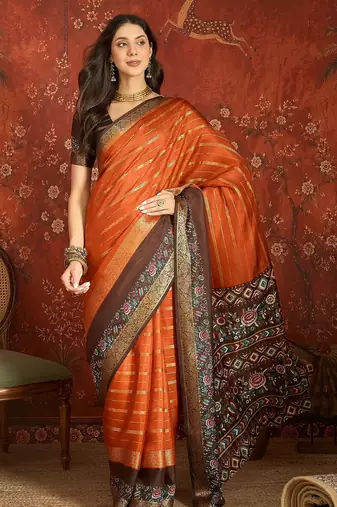 Orange silk cotton zari saree with unstitched blouse piece.
