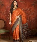 Orange silk cotton zari saree with unstitched blouse piece.