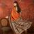 Orange silk cotton zari saree with unstitched blouse piece.