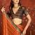 Orange silk cotton zari saree with unstitched blouse piece.