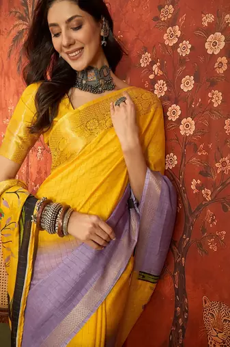 Lilac & yellow silk cotton printed saree with unstitched blouse piece.