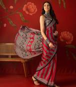 Red satin ajrakh printed saree with unstitched blouse piece.