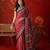 Red satin ajrakh printed saree with unstitched blouse piece.