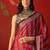 Red satin ajrakh printed saree with unstitched blouse piece.