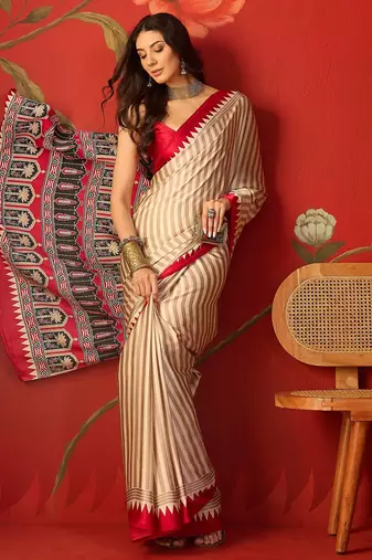 Beige satin printed saree with unstitched blouse piece.