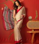 Beige satin printed saree with unstitched blouse piece.
