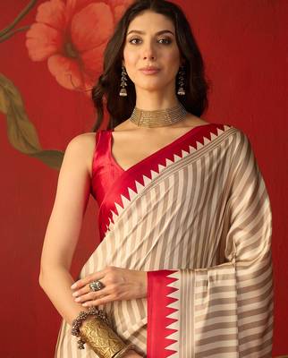 Beige satin printed saree with unstitched blouse piece. 4