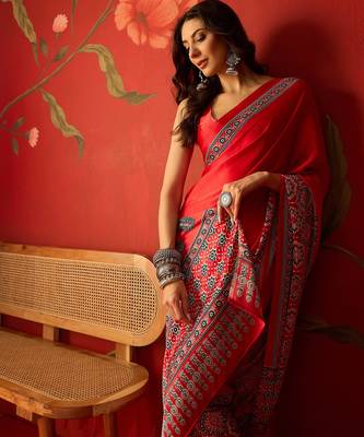 Red satin ajrakh printed saree with unstitched blouse piece. 1
