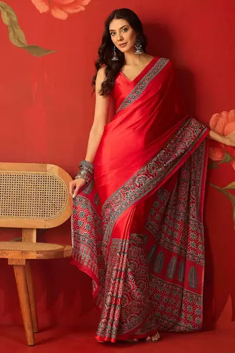 Red satin ajrakh printed saree with unstitched blouse piece.