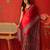 Red satin ajrakh printed saree with unstitched blouse piece.