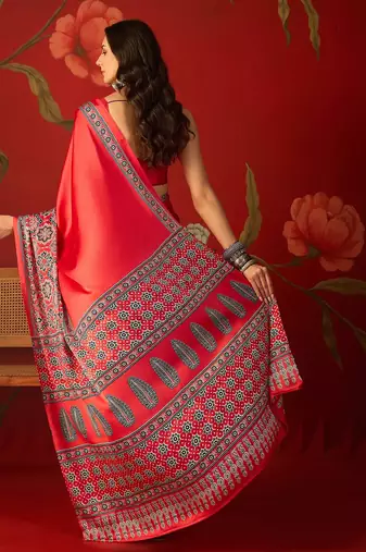 Red satin ajrakh printed saree with unstitched blouse piece.