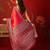 Red satin ajrakh printed saree with unstitched blouse piece.