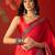 Red satin ajrakh printed saree with unstitched blouse piece.