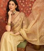 Beige chiffon embroidered saree with unstitched blouse piece.