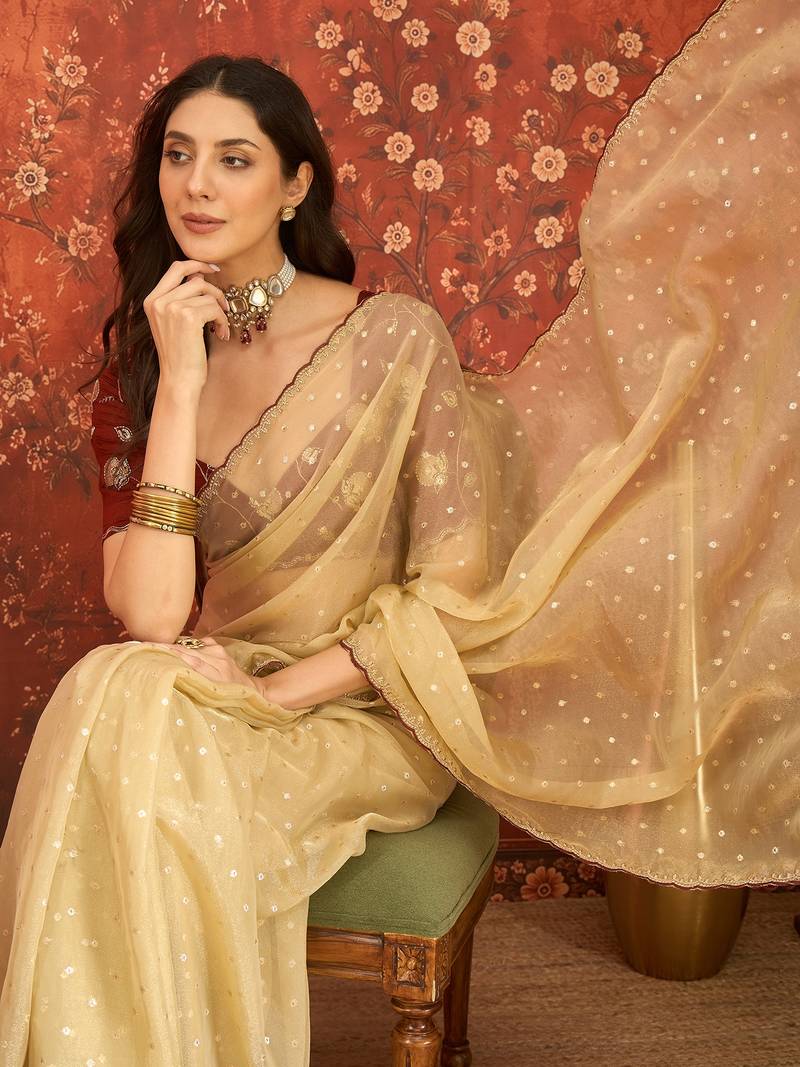 Beige chiffon embroidered saree with unstitched blouse piece.
