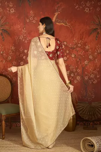 Beige chiffon embroidered saree with unstitched blouse piece.