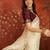 Cream tissue embroidered saree with unstitched blouse piece.