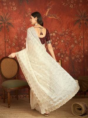 Cream tissue embroidered saree with unstitched blouse piece. 4