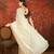 Cream tissue embroidered saree with unstitched blouse piece.