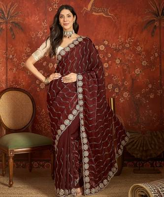 Maroon tissue embroidered saree with unstitched blouse piece. 1