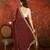 Maroon tissue embroidered saree with unstitched blouse piece.