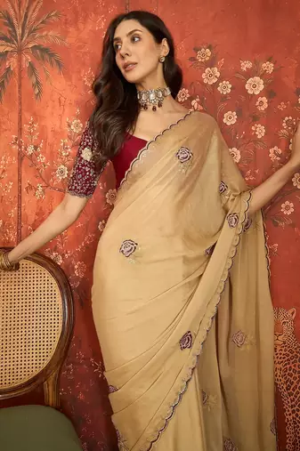 Beige silk blend embroidered saree with unstitched blouse piece.