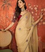 Beige silk blend embroidered saree with unstitched blouse piece.
