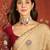 Beige silk blend embroidered saree with unstitched blouse piece.