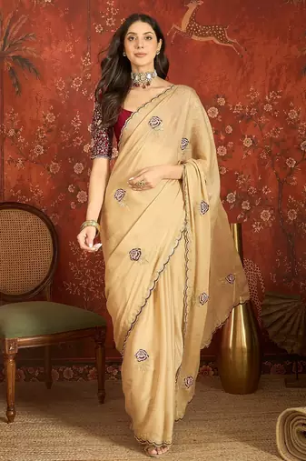 Beige silk blend embroidered saree with unstitched blouse piece.