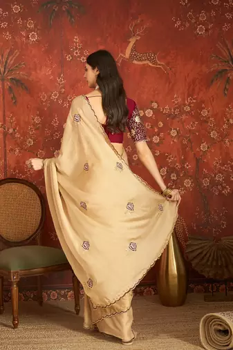 Beige silk blend embroidered saree with unstitched blouse piece.