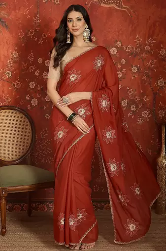 Rust chiffon embroidered saree with unstitched blouse piece.