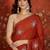 Rust chiffon embroidered saree with unstitched blouse piece.