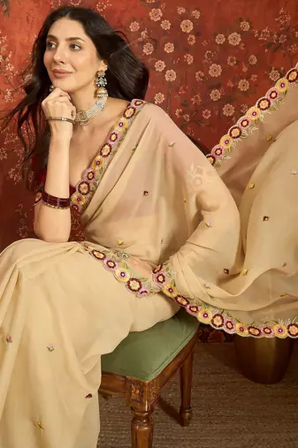 Beige chiffon embroidered saree with unstitched blouse piece.