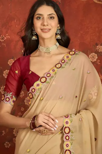 Beige chiffon embroidered saree with unstitched blouse piece.