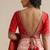 Red embroidered silk blouse