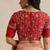Red embroidered silk blouse