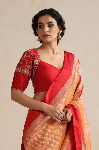 Red embroidered silk blouse