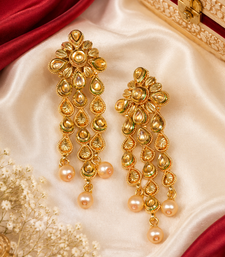 Floral kundan and leaf drop earrings