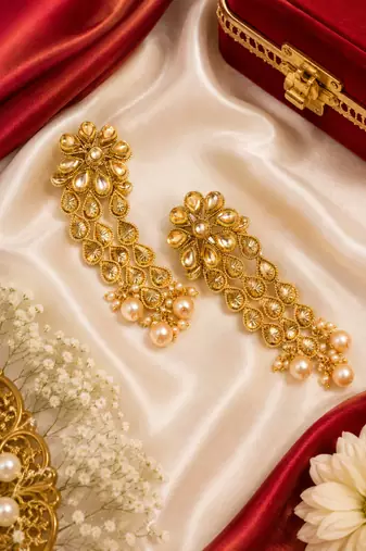 Dangler kundan and gold leaf long earrings