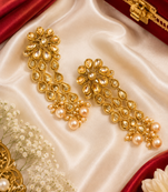 Dangler kundan and gold leaf long earrings