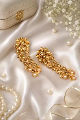 Dangler kundan and gold leaf long earrings