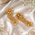 Dangler kundan and gold leaf long earrings