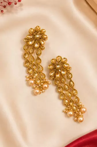 Dangler kundan and gold leaf long earrings