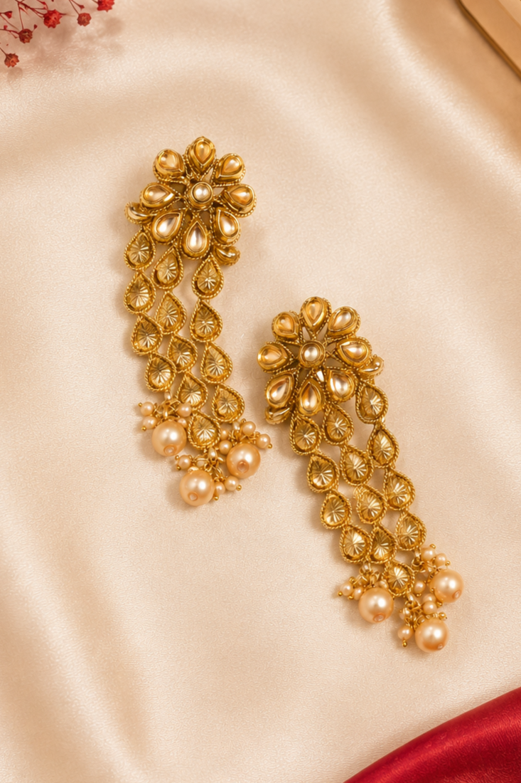 Dangler kundan and gold leaf long earrings