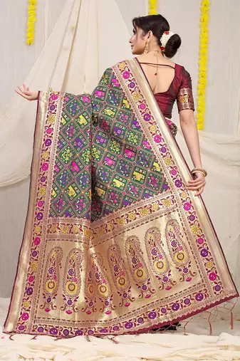 Dark green patola silk blend saree with blouse piece