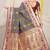 Dark green patola silk blend saree with blouse piece